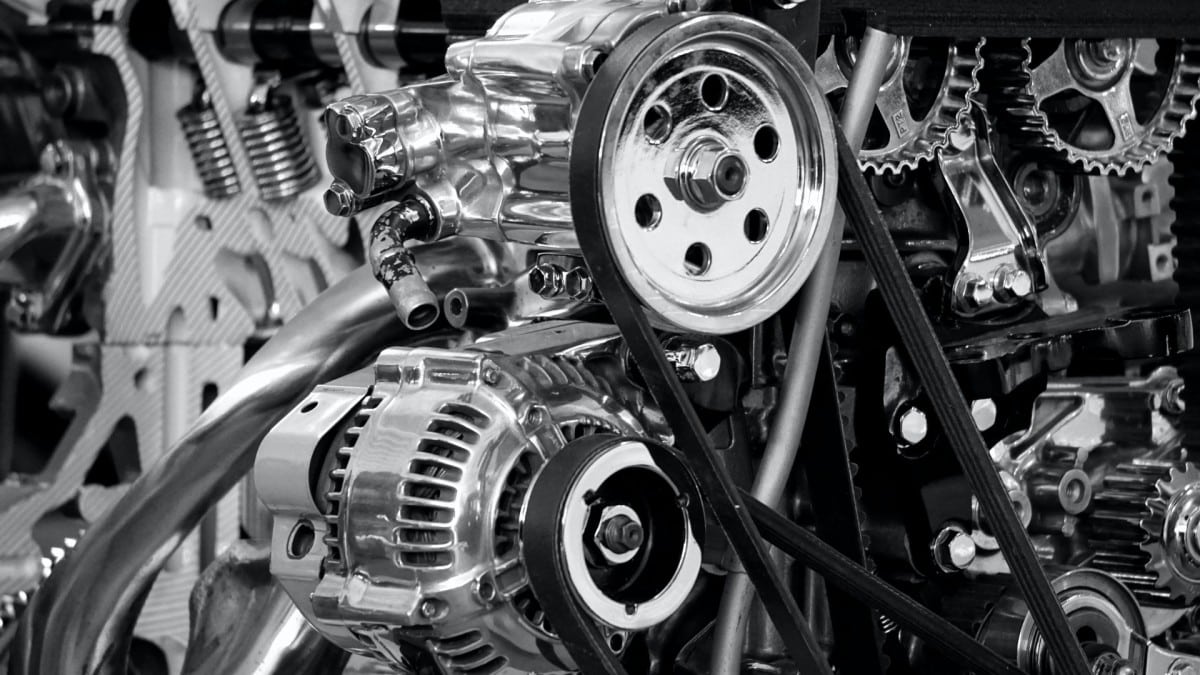 A black and white photo of a car engine being worked on by an auto mechanic in Santa Rosa.